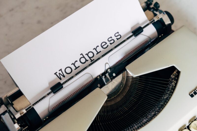 white vintage typewriter with paper